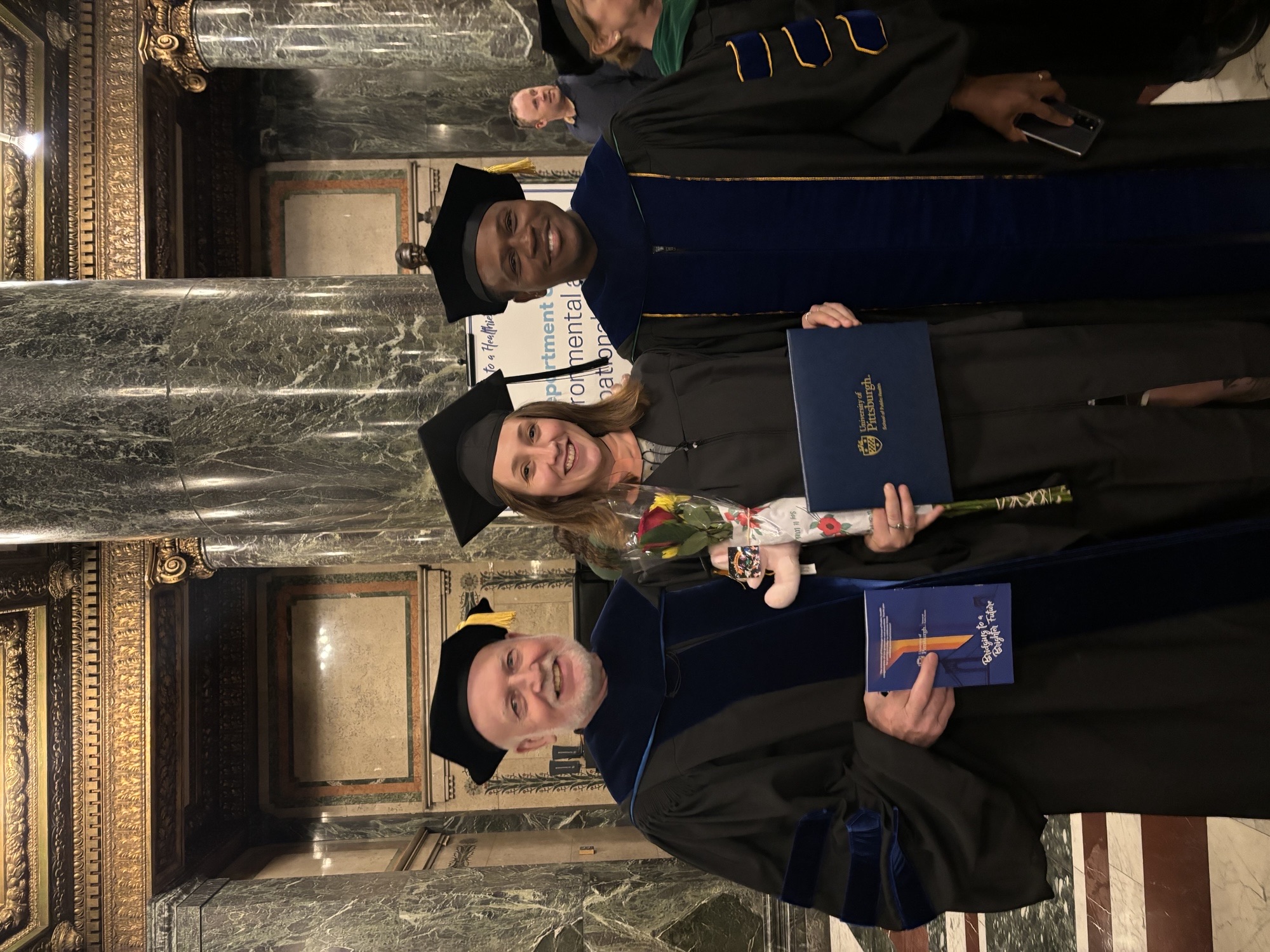 posing for a photo at graduation
