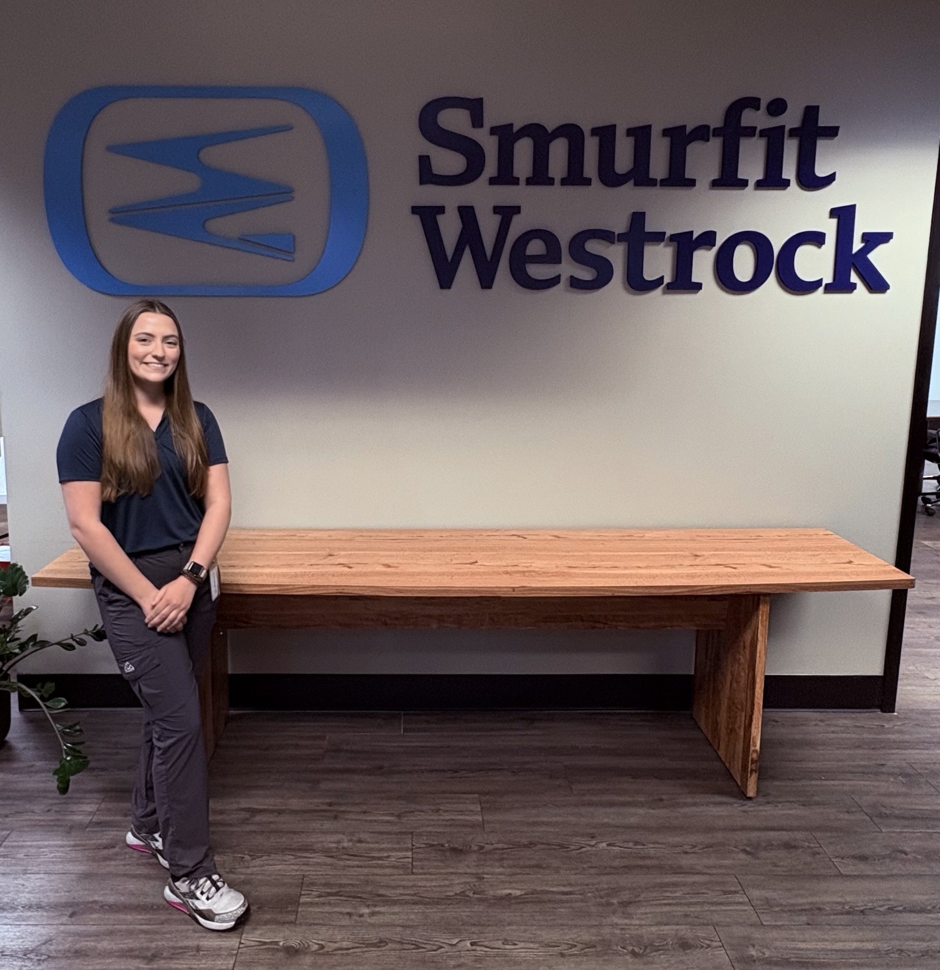 Liz on site with Smurfit Westrock on the wall behind her