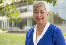 "Maureen Lichtveld in front of Public Health building"