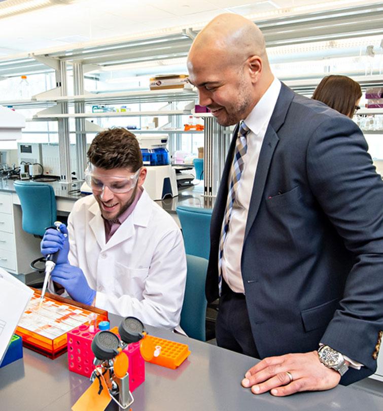 Professor and student in lab