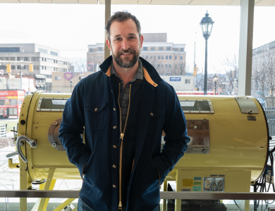 Noah Wylie in front of the Iron Lung