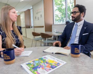 two faculty in commons
