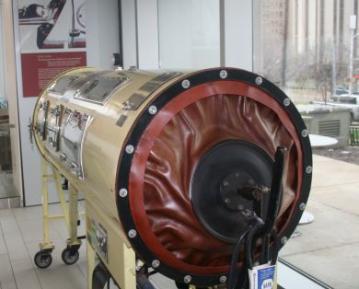 Iron Lung, feet end, picture of child in iron lung in the background