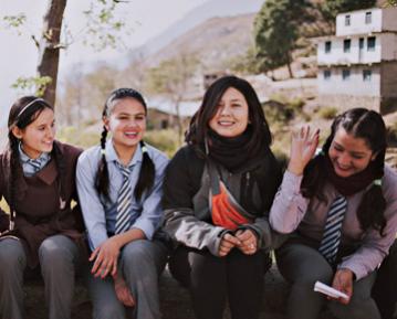 Students sitting together and smiling