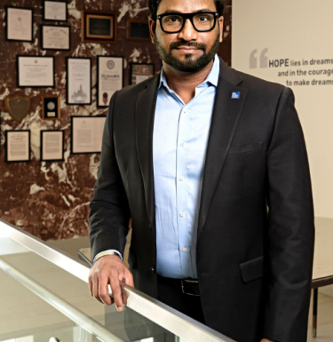 Suresh Kuchipudi poses for a photo