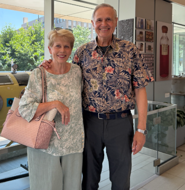Segretti and his wife in front of Iron Lung at Pitt Public Health