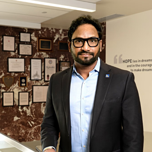 Suresh Kuchipudi poses for a photo