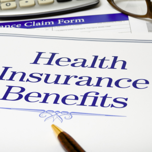 health insurance benefits forms calculator, glasses, pen