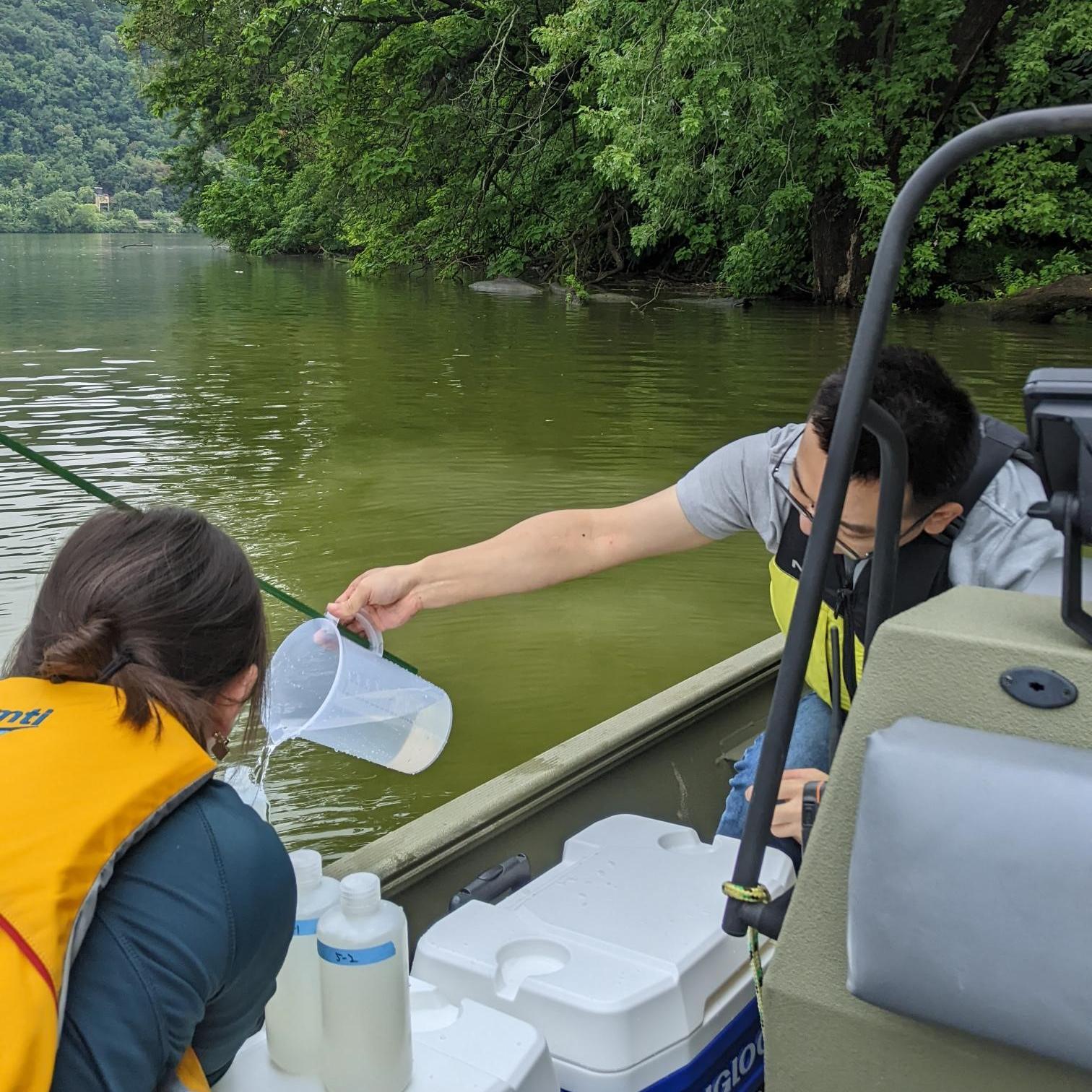 students working on study in a river